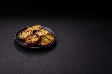 Food, potatoes cut in halves or slices grilled. Cooked baked potatoes