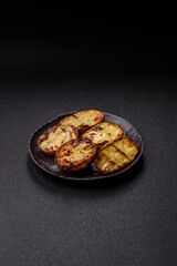 Food, potatoes cut in halves or slices grilled. Cooked baked potatoes