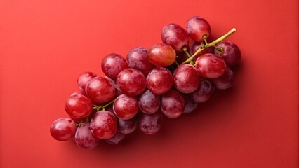 Fototapeta premium Fresh ripe red grapes on the vine in a healthy bunch