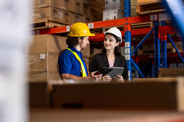 Female manager and male worker checking on shelf with digital tablet in warehouse. Professional workers management business delivery import - export online stock for logistics.