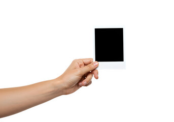 A hand holds a polaroid blank picture, isolated on white or transparent background. PNG