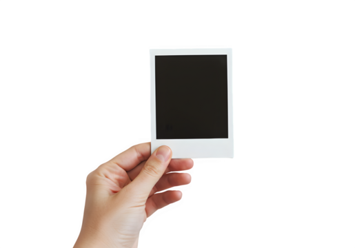 A hand holds a polaroid blank picture, isolated on white or transparent background. PNG