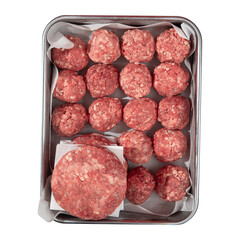 Isolated semi finished patties and meatballs in a metal tray