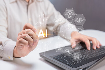 A person interacts with a laptop, with a glowing "AI" and digital icons representing artificial intelligence technology.