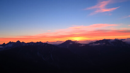Obraz premium mountainous landscape, dramatic sunset sky, silhouetted peaks, vibrant colors, dramatic lighting, serene atmosphere, atmospheric, cinematic, highly detailed, photorealistic, 32K Revolution 