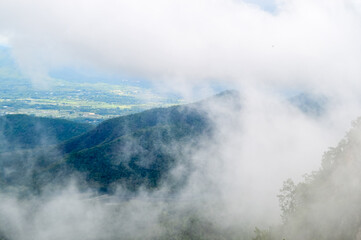 Obraz premium Mist in the valley during the Rain Season.Natural Rain Season landscape Northern Thailand.