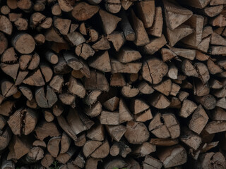 A dense pile of stacked firewood, perfect for a cozy evening by the fireplace.