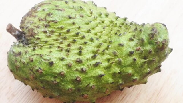 soursop fruit on wooden table. Soursop fruit texture