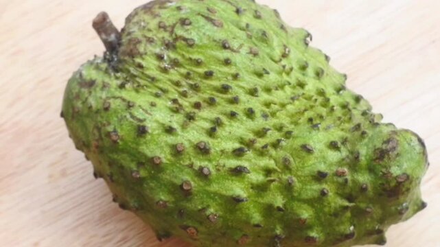 soursop fruit on wooden table. Soursop fruit texture
