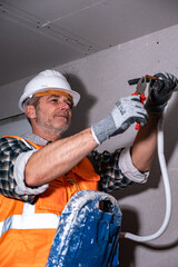 Air Conditioner Installer Working with Copper Pipe