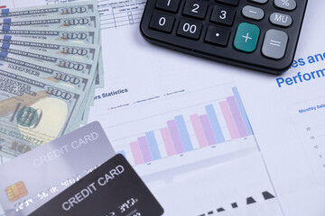 Money, credit cards, financial charts, and a calculator representing finance, budgeting, and accounting.