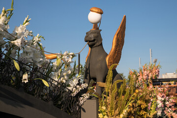 Griffins of the Bank Bridge in the flower arrangement "Guardians of St. Petersburg" at the International Flower Festival in St. Petersburg