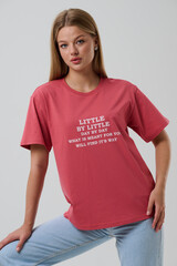 Girl model in casual clothes on a gray background posing in the studio