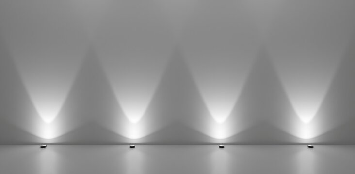 Series of spotlights from the floor in white room against wall, empty room background template