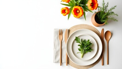 Elegant table setting with orange tulips and wooden cutlery