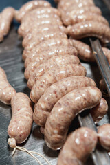 Close up of sausages production process at the meat factory.
