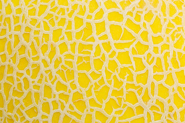 Close-up of melon peel texture,The texture of the peel of a yellow melon close-up. Selective focus,...