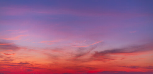 Fototapeta premium Colorful sky backdrop in the morning,Nature beautiful Light Sunset or sunrise sky,Sunset Sky Background in the Evening with Dramatic Dusk Clouds and Colorful Pink, Orange Sunlight on Blue Twilight sky