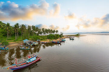 Fototapeta premium Coastal view and fishing boats in the morning, Prachuap Khiri Khan Province, Thailand,Longtail boat tour of coastal fishing villages, beautiful morning sunrise view over the sea and mountains.