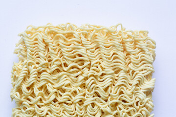 Closed up of uncooked, dry, or raw instant noodles. Isolated on white background.