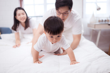 Before putting the kids to bed, parents, and kid unwind and play in the bedroom