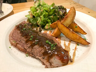 Gourmet Steak with Wedges and Salad