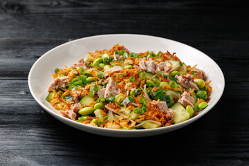 Crispy Rice Tuna Salad with edamame beans, cucumber, onion