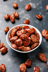 Caramelized almonds. Toasted almonds coated with caramel syrup.