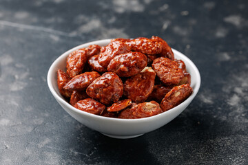 Caramelized almonds. Toasted almonds coated with caramel syrup.