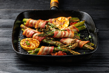 Grilled Bacon Wrapped Asparagus in iron cast pan