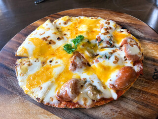 Delicious Cheesy Pizza on Wooden Board