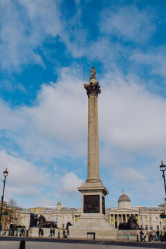 London's iconic Trafalgar Square is captured with its towering Nelson's Column monument, a central landmark surrounded by grand architecture and the vibrant energy of the city.