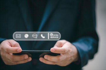 24-7 customer service support concept. Businessman hands holding digital contact icons, including email, phone, and chat, representing communication, accessibility, and online business care.