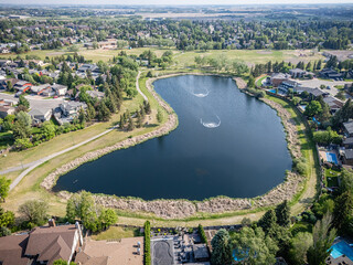 Large body of water with a small fountain in the middle