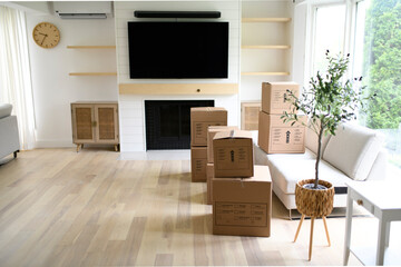 Interior with moving boxes in empty white room