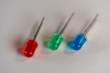  Red Green Blue LED parts laying next to each other macro shot on white background