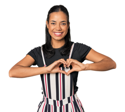 Young Filipino woman in studio smiling and showing a heart shape with hands.