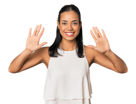 Young Filipino woman in studio showing number ten with hands.
