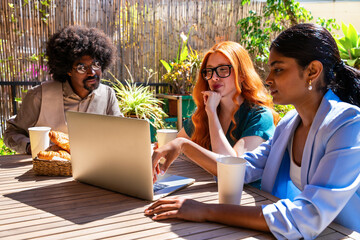 Plakat Multiethnic small group of businesspeople meeting in a coworking company office