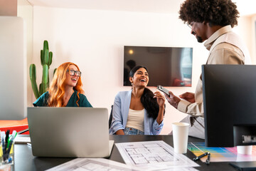 Multiethnic small group of businesspeople meeting in a coworking company office