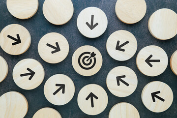 Every arrow wood block points at the same target at the center, all for one purpose, teamwork,...