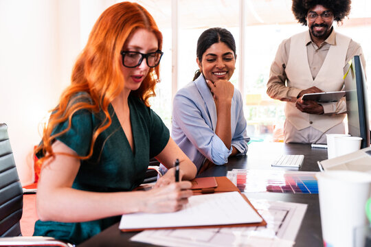 Multiethnic small group of businesspeople meeting in a coworking company office