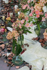 Elegant floral table setting with pink flowers and romantic decor. Floral Table Decor with Pink and Dried Flowers