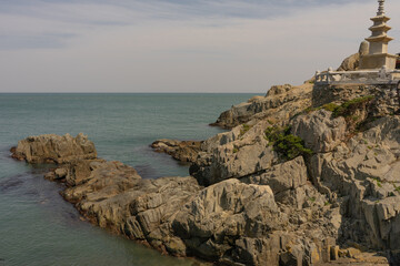Haedong Yonggungsa Temple coastal landscape, tranquil mood, rocky shore and ocean view, Busan, South Korea