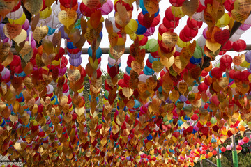 Colorful lanterns with wish notes, traditional festival mood, representing hope and blessings, Busan, South Korea, Haedong Yonggungsa Temple backdrop