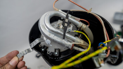 Electric coffee maker disassembled for maintenance