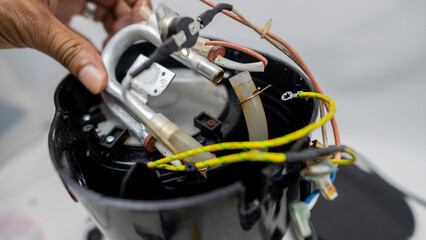 Electric coffee maker disassembled for maintenance