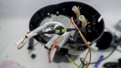 Electric coffee maker disassembled for maintenance