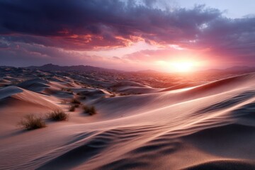 Vibrant sunset over rolling sand dunes in the desert