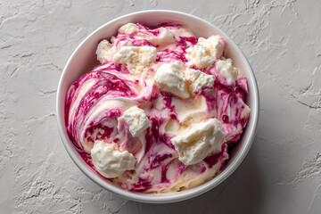 Eton mess dessert with strawberry sauce and meringue in a bowl